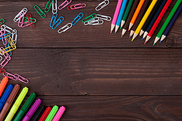 Image showing School supplies on a wooden table