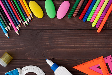 Image showing School supplies on a wooden table