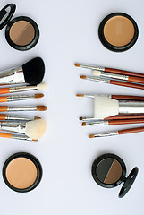 Image showing makeup brush and cosmetics, on a white background