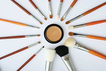 Image showing makeup brush and cosmetics, on a white background