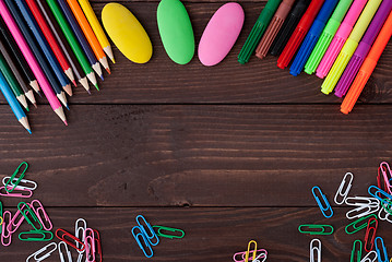 Image showing School supplies on a wooden table