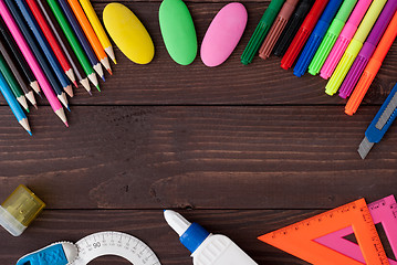 Image showing School supplies on a wooden table