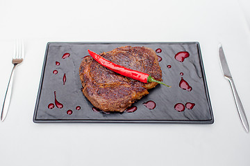 Image showing grilled steak with pepper