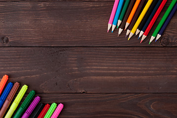 Image showing Colored pencils on a wooden board