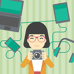 Image showing Woman surrounded with her gadgets.