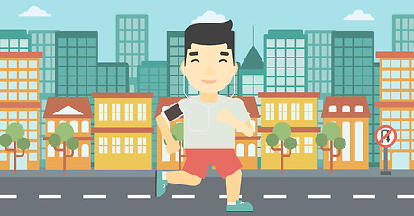 Image showing Man running with earphones and smartphone.