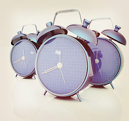 Image showing 3d illustration of glossy alarm clocks against white background 