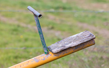 Image showing Old wooden and steel seesaw