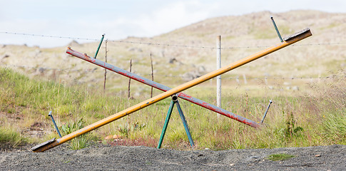 Image showing Old wooden and steel seesaw