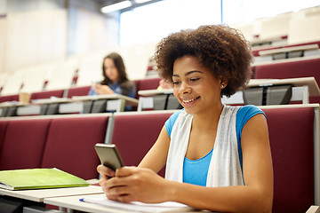 Image showing african student girl with smartphone at lecture