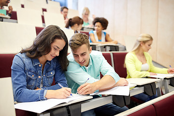 Image showing group of students with notebooks at lecture hall