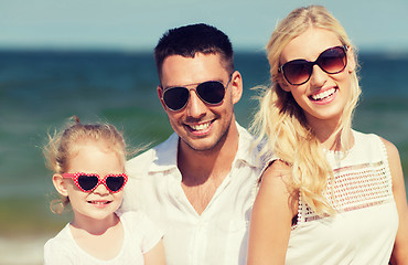 Image showing happy family in sunglasses on summer beach