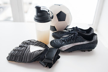 Image showing close up of football, boots, gloves and bottle