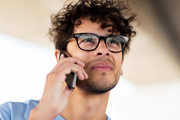 Image showing man with smartphone calling on city street