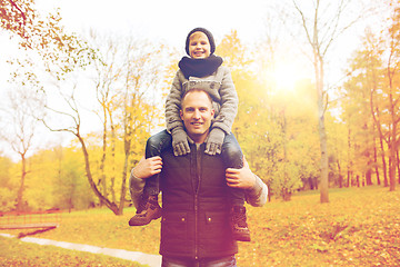 Image showing happy family having fun in autumn park