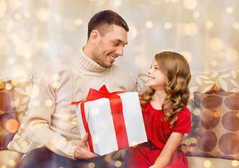 Image showing smiling father and daughter looking at each other