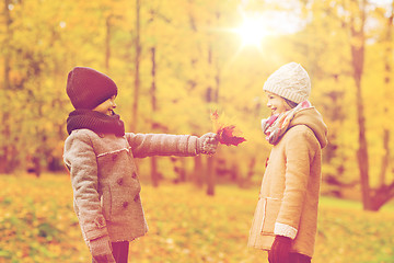 Image showing smiling children in autumn park