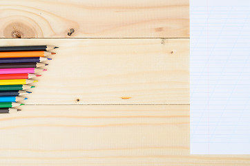 Image showing Colored pencils on a wooden board