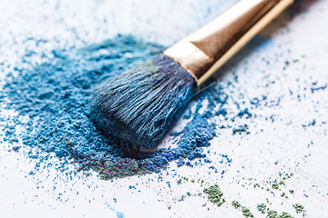 Image showing scattered blue eye shadows close-up