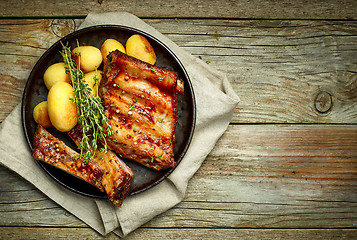 Image showing grilled pork ribs and potatoes