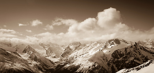 Image showing Panorama of sunny winter mountains in clouds