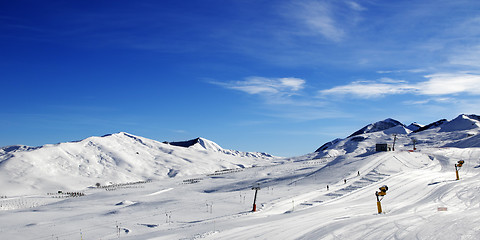 Image showing Panoramic view on ski slope with snowmaking at sun day