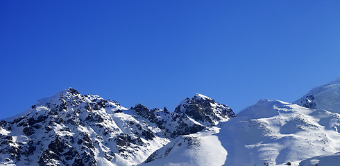 Image showing Panoramic view on snow mountains and off-piste slope on sunny da