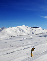 Image showing Ski slope with snowmaking at sun day