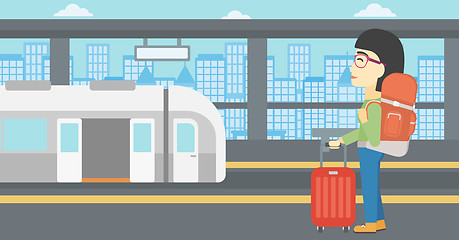 Image showing Woman at the train station vector illustration.