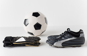 Image showing close up of goalkeeper gloves, ball, soccer boots