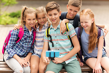 Image showing happy elementary school students taking selfie