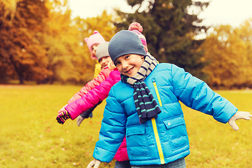 Image showing group of happy children having fun in autumn park