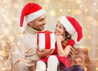 Image showing smiling father giving daughter gift box