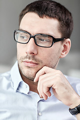 Image showing portrait of  businessman in eyeglasses at office