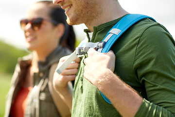 Image showing close up of couple with backpacks hiking outdoors