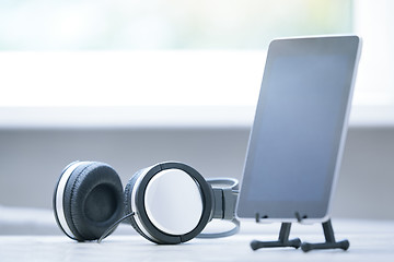 Image showing Headphones and digital tablet at office