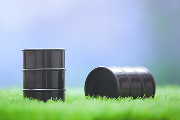 Image showing Oil barrels in the grassland