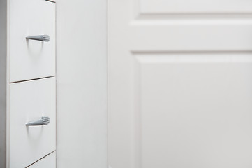 Image showing Cabinet with sliding trays and chrome handles