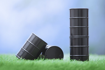 Image showing Oil barrels in the grassland