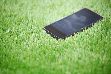 Image showing Smartphone in the grass