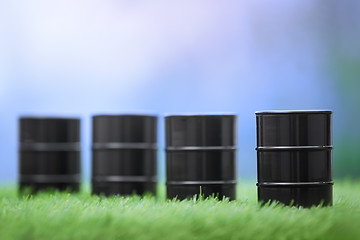 Image showing Oil barrels in the grassland