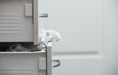 Image showing Messy clothes in wardrobe