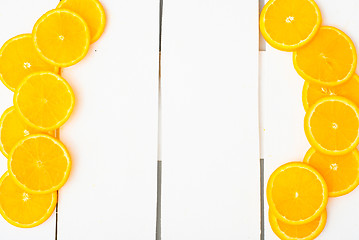 Image showing Colorful citrus fruits on the rustic white background.