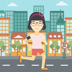 Image showing Woman running with earphones and smartphone.