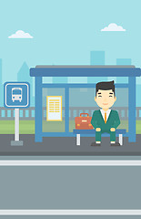 Image showing Man waiting for bus at the bus stop.