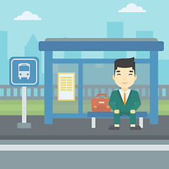 Image showing Man waiting for bus at the bus stop.