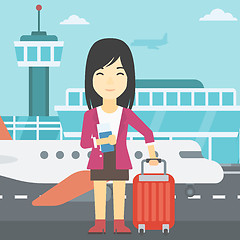 Image showing Woman with suitcase and ticket at the airport.