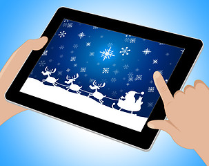Image showing Reindeer Santa Shows Winter Snow And Congratulation Tablet