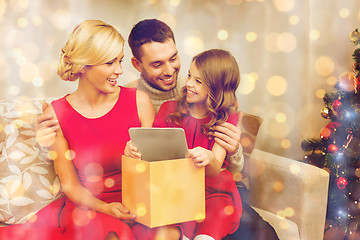 Image showing smiling family with tablet pc