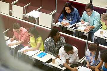 Image showing group of students with notebooks at lecture hall